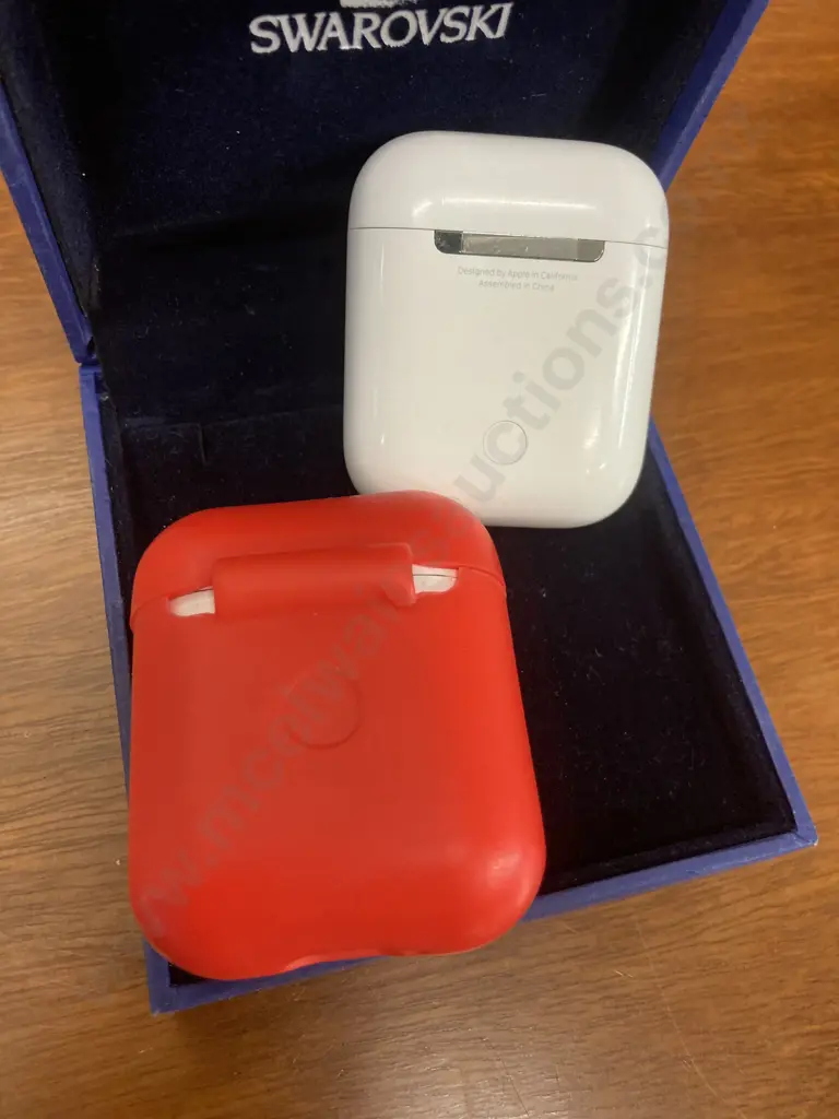 Pair of Single Apple AirPods With Charging Cases & a Red Cover (Model A1602) Image 1++